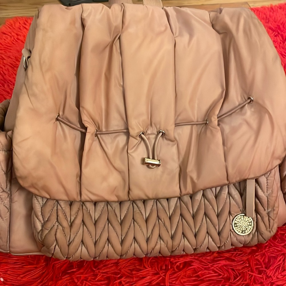 Happ diaper bag. Used with a few stains that can be wiped out. Dusty rose color